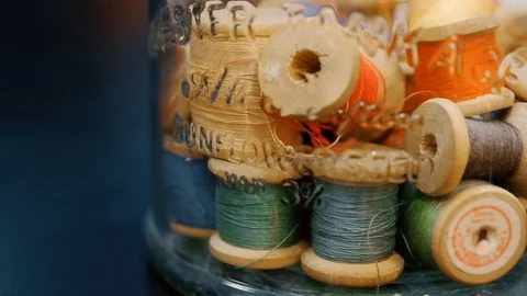 Closeup dolly shot of thread spools 動画素材 115959782