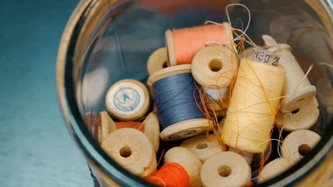 Closeup dolly shot of thread spools Stock Footage 116758571