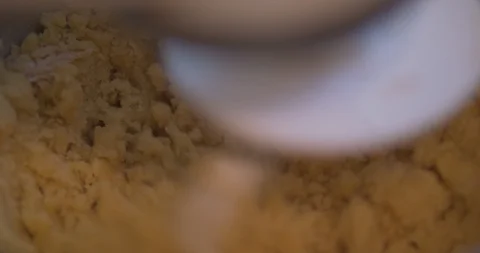 Closeup on Dough as it is Mixed By an Electronic Mixer Stock Footage 101061844