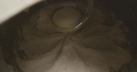 Closeup Of Dough Kneaded In A Mixing Bowl Vídeo Stock 340263043