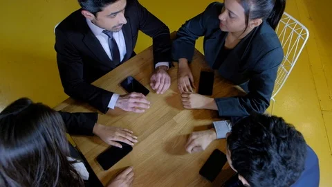 Closeup down to colleagues celebrating their success and raise their hands in ce Stock Footage 104530698