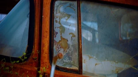 Closeup downwards motion rusty car colour graded Stock Footage 74021790