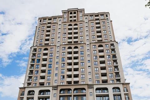 Closeup dramatic facade study emphasizing arches, stone balconies and repetit Stock Photos
