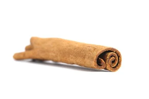 Closeup dried cinnamon stick isolated on a white background Stock Photos