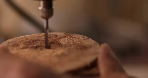 Closeup of drill and hole in the piece of wood Video stock 233587359