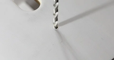 Closeup of a drill bit drilling a hole in a wooden plank Stock Footage 105430278