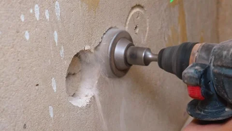 Closeup Of Drill Cutting Circular Hole In Plaster Wall With Debris Video stock 329106449