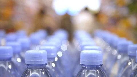Closeup On Drinking Water Bottles In Raw And Lines In Supermarket 库存影片 98460068