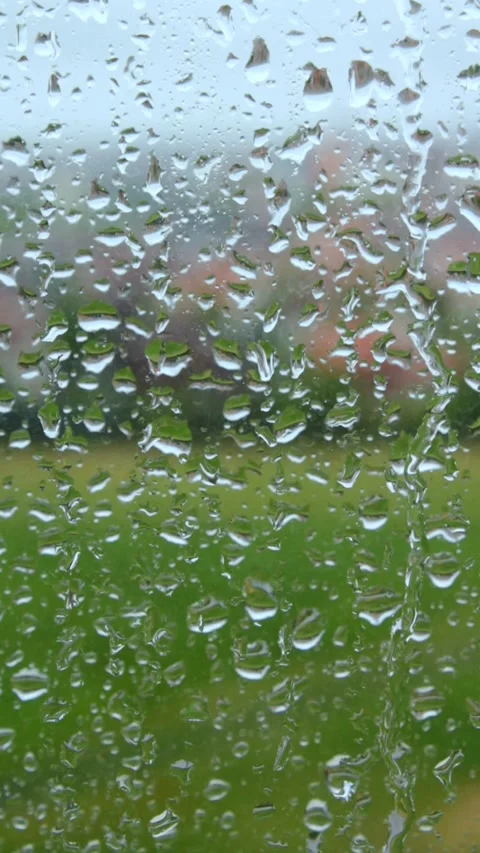 Closeup Droplets Of Rain Running Down Glass Window On Cloudy Day 스톡 동영상 240753726