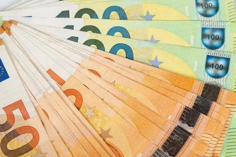 Closeup of dynamic spread of euro banknotes in radial composition, overlapp.. Stock Photos