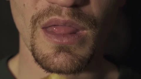 Closeup eating chips. slow motion. on a black background Stock Footage 130523833