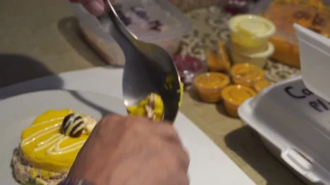 Closeup eating a plate of Causa de Peru of crab pulp with tomato and olive Stock Footage 154814393