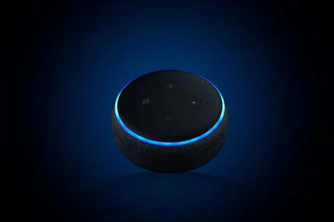 Closeup of an Echo Dot, Voice assistant on dark blue background Stock Photos