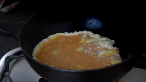 Closeup egg frying or cooking in the pan prepare for omelet, slow-motion Stock Footage 130048536