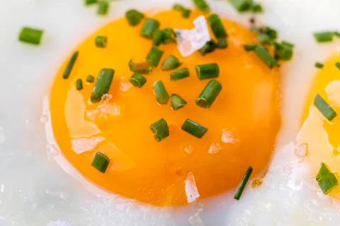Closeup of a egg in a pan Stock Photos