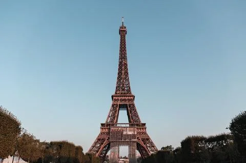 Closeup of the Eifel tower under the blue sky in Paris, France Stock Photos