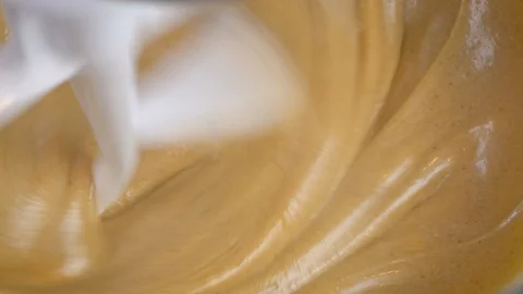 Closeup of Electric Stand Mixer Mixing Golden Brown Cookie Dough in 4k Stock Footage 101397731