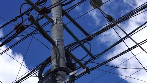 Closeup of an electrical connection on a pole in the street seen from below with Vidéo 164587639