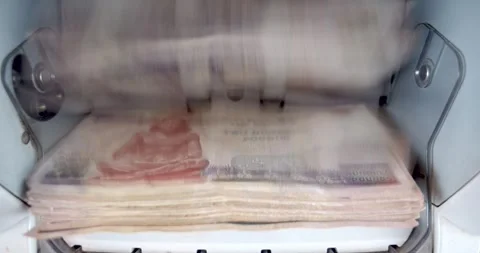 Closeup of Electronic Cash Counting Machine for Counting Egyptian Currency Stock Footage 317922663