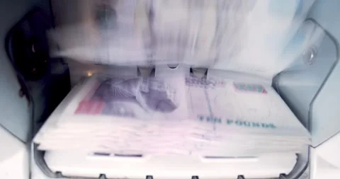 Closeup of Electronic Cash Counting Machine for Egyptian Pound Transactions Stock Footage 317922715