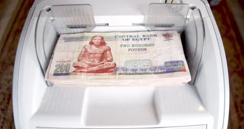 Closeup of Electronic Cash Counting Machine for 200 Egyptian Pound Notes Stock Footage 317923396