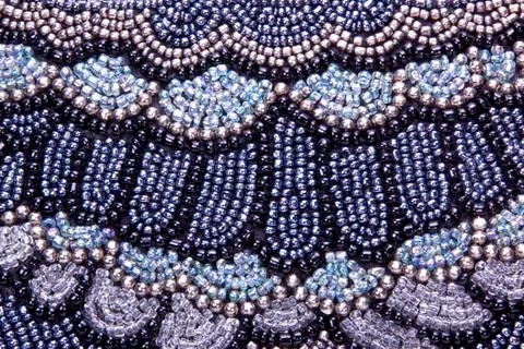 Closeup of embroided pattern in beads on scatter cushion Stock Photos