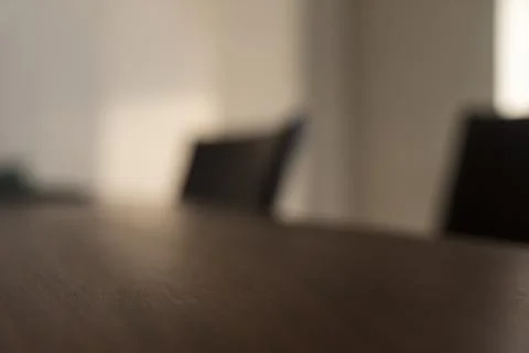 Closeup of empty dining table with natural windows light Foto stock