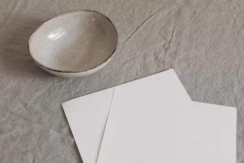 Closeup of empty paper sheets, pages mockups on beige table backgound. Office Fotos Stock