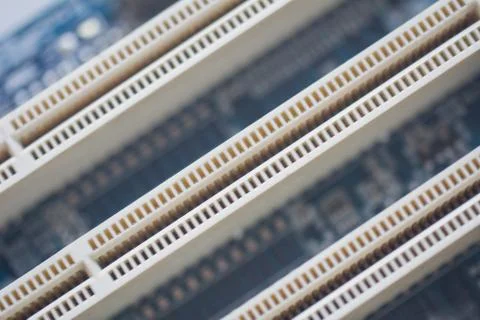 Closeup on empty pci or ram slots on a modern blue motherboard. Electronics,  스톡 사진