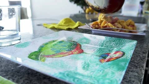 Closeup of an empty plate waiting to be served with food and in the background Stock Footage 172270714