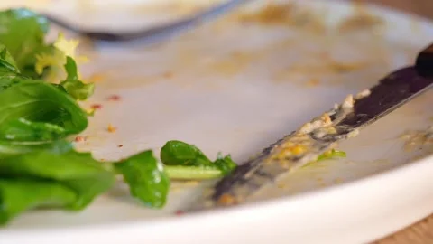 Closeup of empty plate on a wooden table Stock Footage 311495648