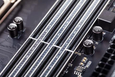 Closeup on empty RAM slots on a modern black silver motherboard Stock Photos