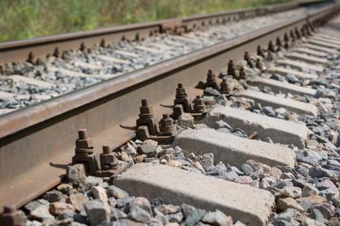 Closeup of empty straight railways track. Perspective view. Stock Photos
