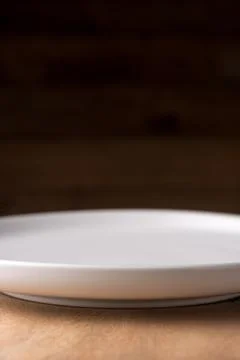 Closeup empty white plate, background or backdrop Stock Photos