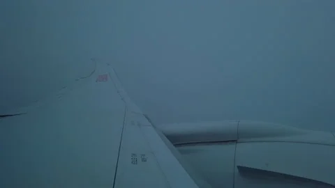 Closeup of engine of Aircraft flying in cloud. Video stock 145575992