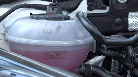 Closeup on an engine cooling system under a car hood Video stock 92406964
