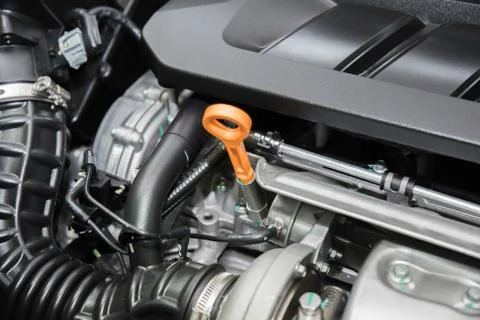 Closeup engine oil cap in engine room at modern car. Interior of car. Stock Photos