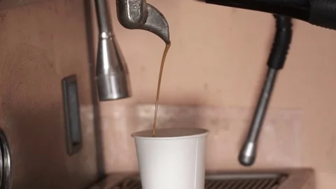 Closeup of espresso pouring into plastic cup, slow motion Stock Footage 72229499