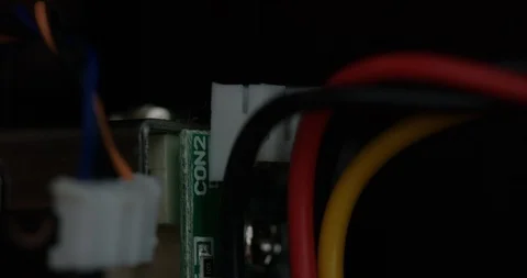 Closeup of ethernet cable being plugged in among other colorful cables Stock Footage 105438784