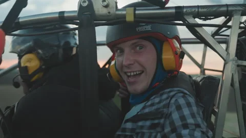Closeup excited pilot preparing paraglider for dramatic flight Stock Footage 317190497