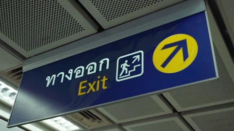 Closeup of exit sign on the subway station before the cashier in thai and englis Stock Footage 299710796