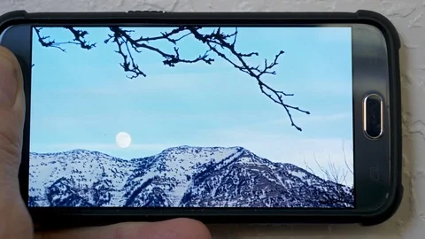 Closeup-Expand and adjust position of photo on smart phone Stock Footage 102128943