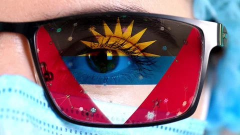 Closeup, eye, part of doctor face in medical mask, glasses, which painted in Vídeos de archivo 129341102