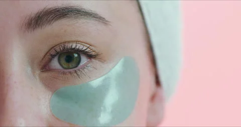 Closeup of eye, patch and facial for beauty, wellness and cosmetics isolated on Stock Footage 260827619