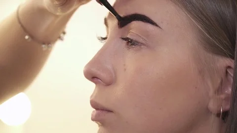 Closeup of the eyebrows colored with henna Stock Footage 73569766