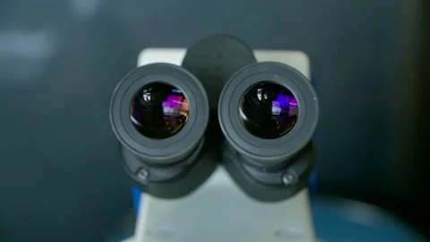 Closeup of eyes pieces of microscope in laboratory.
White optical Stock Footage 155823616