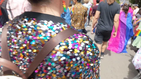 Closeup of a fabulous sequin jacket of someone marching in the pride parade Stock Footage 338017845