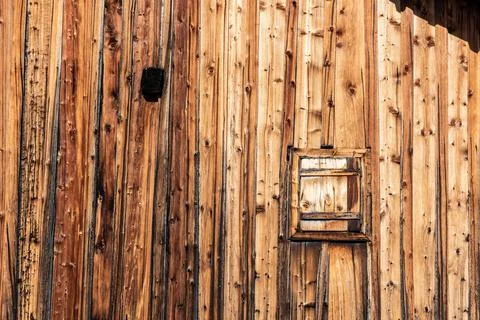 Closeup of the facade of a typical Alpine hut, the Dolomite Alps in South Tir Stock Photos