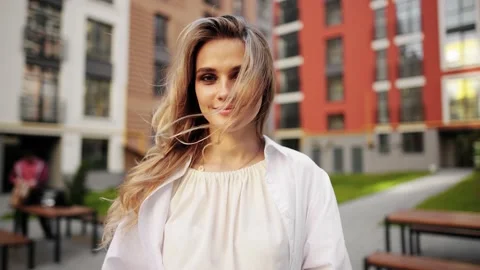 Closeup face of beautiful blond sexy smiling woman with long hair. Portrait of Stock Footage 154457799