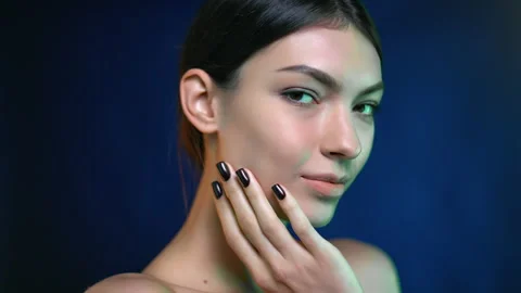 Closeup face beautiful mixed race brunette woman perfect young moisturizing skin Stock Footage 166136038